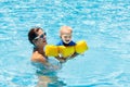 Mother and baby in swimming pool Royalty Free Stock Photo