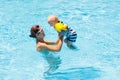 Mother and baby in swimming pool Royalty Free Stock Photo