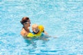 Mother and baby in swimming pool Royalty Free Stock Photo