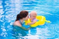 Mother and baby in a swimming pool Royalty Free Stock Photo