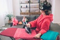 Mother and baby together engaged in housework Ironing clothes . Housewife and kid doing homework. Woman with little Royalty Free Stock Photo