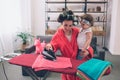 Mother and baby together engaged in housework Ironing clothes . Housewife and kid doing homework. Woman with little Royalty Free Stock Photo