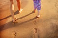 Mother and baby walking along the beach. Royalty Free Stock Photo