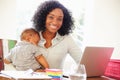 Mother With Baby Working In Office At Home Royalty Free Stock Photo