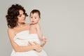 mother with bare shoulders holding in Royalty Free Stock Photo