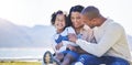 Mother, beach or father laughing with child bonding in Brazil to relax with love, smile or care in summer. Happy family Royalty Free Stock Photo