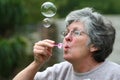 mother blowing bubbles