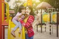 Mother blows soap bubbles with her daughter Royalty Free Stock Photo