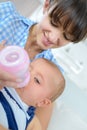 Mother bottle feeding baby