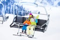 Mother with boy lifting on ski lift Royalty Free Stock Photo