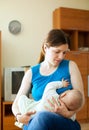 Mother breast feeding baby at home Royalty Free Stock Photo