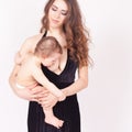 Mother breast feeding a cute baby. Newborn girl. Royalty Free Stock Photo