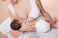 Mother breast feeding her child