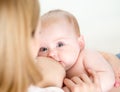 Mother breast feeding her infant baby girl Royalty Free Stock Photo