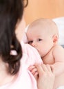 Mother breast feeding and hugging her baby Royalty Free Stock Photo