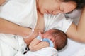 Mother breast feeding and hugging infant baby Royalty Free Stock Photo