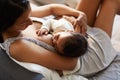 Mother breastfeeding baby in comfortable position