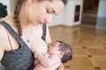 The mother is breastfeeding the baby. mother breastfeeds and hugs the baby, close-up breast. Mom breastfeeds her newborn baby. Royalty Free Stock Photo