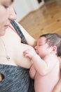 The mother is breastfeeding the baby. mother breastfeeds and hugs the baby, close-up breast. Mom breastfeeds her newborn baby. Royalty Free Stock Photo