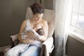 Mother breastfeeding her little baby boy in arms. Royalty Free Stock Photo