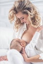 Mother breastfeeding her little baby in her arms Royalty Free Stock Photo