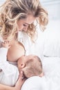 Mother breastfeeding her little baby in her arms Royalty Free Stock Photo