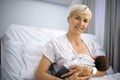 Mother breastfeeding her newborn baby boy in the hospital Royalty Free Stock Photo