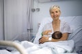 Mother breastfeeding her newborn baby boy in the hospital Royalty Free Stock Photo