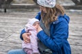 Mother breastfeeding her newborn baby girl in the park Royalty Free Stock Photo