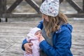 Mother breastfeeding her newborn baby girl in the park Royalty Free Stock Photo