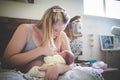 Mother breastfeeding her newborn baby at home after the hospital Royalty Free Stock Photo