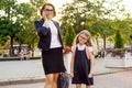 Mom businesswoman takes the child to school. Royalty Free Stock Photo