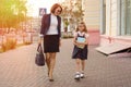 Mother businesswoman takes the child to school. Royalty Free Stock Photo