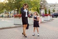 Mother businesswoman takes the child to school. Royalty Free Stock Photo