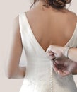 Mother buttoning wedding dress Royalty Free Stock Photo