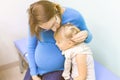 Mother calming daughter at hospital