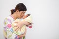 Mother Carrying Her Baby Royalty Free Stock Photo