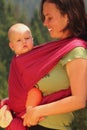 Mother carrying her baby in a sling Royalty Free Stock Photo