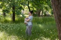 mother carrying her baby in sling Royalty Free Stock Photo