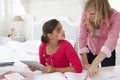 Mother Catches Daughter Using Tablet Computer When Meant To Be Studying Royalty Free Stock Photo