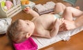 Mother changing diaper of adorable baby Royalty Free Stock Photo