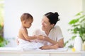 Mother changing diaper on newborn baby Royalty Free Stock Photo