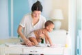 Mother changing diaper on newborn baby Royalty Free Stock Photo