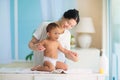 Mother changing diaper on newborn baby Royalty Free Stock Photo