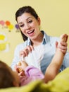 Mother changing diaper to her baby Royalty Free Stock Photo