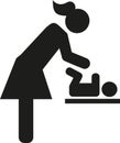 Mother changing nappy baby icon