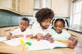 Mother checking children homework Royalty Free Stock Photo