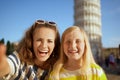 Mother and child against leaning tower in Pisa taking selfie Royalty Free Stock Photo