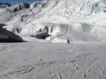 Mother and child alone on a sunny ski slope. Royalty Free Stock Photo