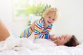 Mother and child in bed. Mom and baby at home Royalty Free Stock Photo